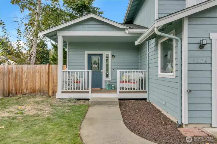 Charming covered front porch to your new home