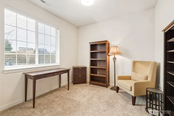 Second bedroom located just off the entry overlooking the front yard.