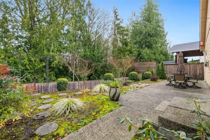 Private fenced yard backs up to a greenbelt.