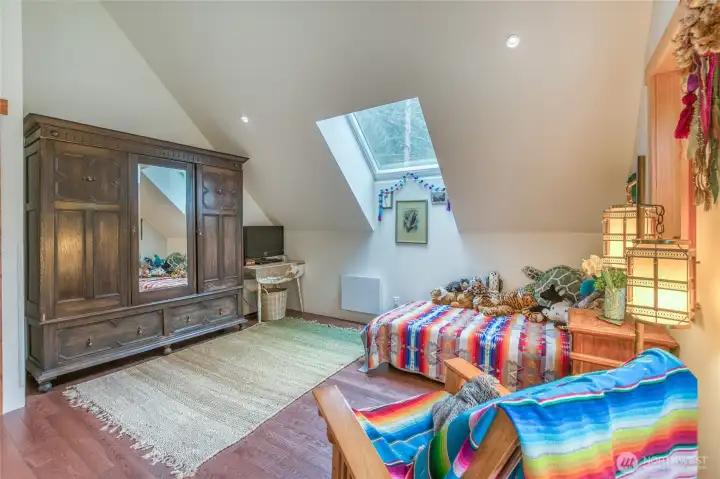 Bedroom view featuring a thoughtfully arranged space with a dark mahogany armoire.