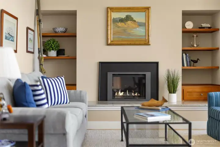 Living room with cozy fireplace and custom built-ins.