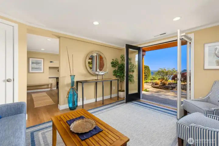 Downstairs, you'll find another living area with french doors welcoming you to a covered patio.