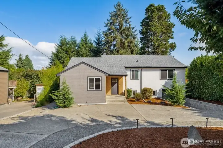 Welcome home! This beautiful half circle driveway greets you!