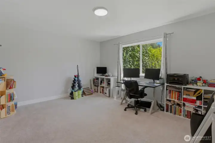 Spacious room located upstairs.