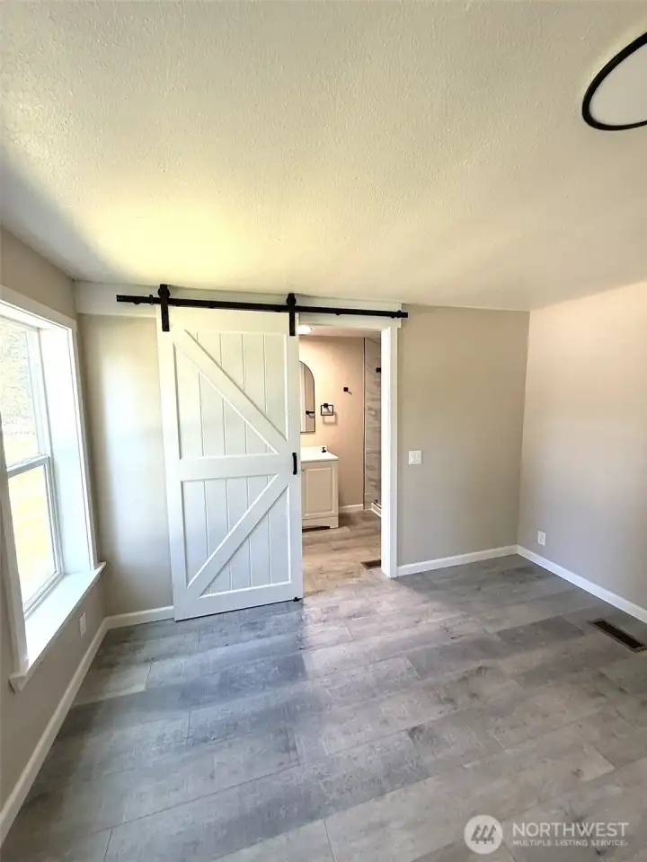 Master bathroom entrance with barn style door