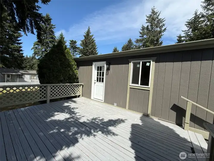 Rear entrance from utility room with large deck