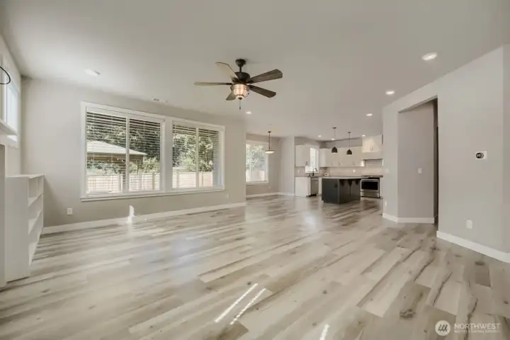 Open-concept design creates a seamless flow between the living room, dining area, and kitchen, ideal for everyday living and entertaining. Open-concept design creates a seamless flow between the living room, dining area, and kitchen, ideal for everyday living and entertaining.