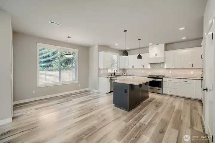 Bright dining space overlooks the backyard and connects effortlessly to the gourmet kitchen. Bright dining space overlooks the backyard and connects effortlessly to the gourmet kitchen.