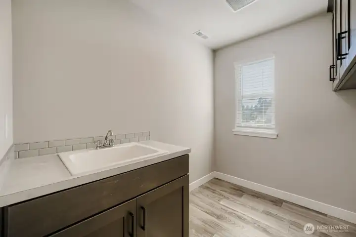 Laundry room with upgraded utility sink. Laundry room with upgraded utility sink.