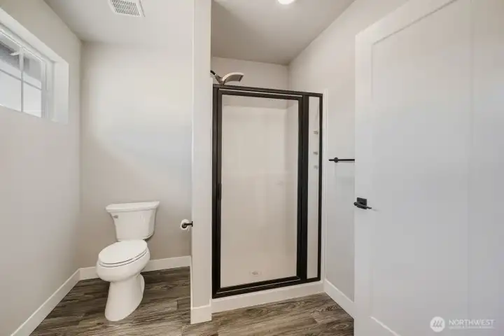 Spacious guest bath with stand-up shower. Spacious guest bath with stand-up shower.
