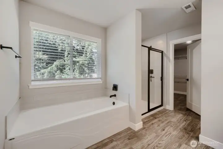 Relax and unwind in the soaking tub while enjoying the spa-inspired walk-in shower and elegant finishes. Relax and unwind in the soaking tub while enjoying the spa-inspired walk-in shower and elegant finishes.