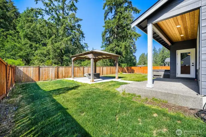 Enjoy outdoor gatherings under the gazebo while surrounded by a fully fenced backyard and peaceful natural setting. Enjoy outdoor gatherings under the gazebo while surrounded by a fully fenced backyard and peaceful natural setting.