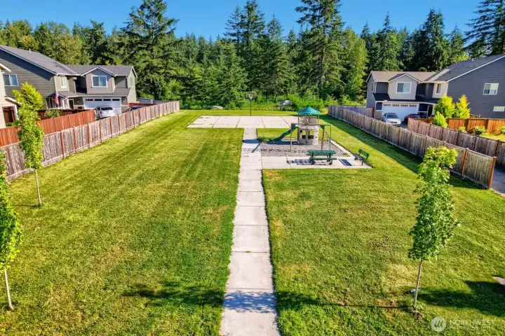Enjoy the neighborhood green space featuring a playground, basketball court, and room to play just steps away. Enjoy the neighborhood green space featuring a playground, basketball court, and room to play just steps away.
