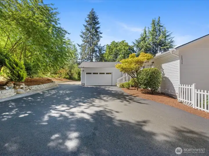 Large inviting driveway to home with plenty of parking