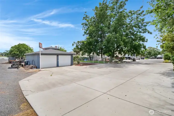 The property corner is the back corner of this slab, just out of view, and goes down to the orange cones at the lake. The gravel driveway on the left is shared so you can access your boat launch.