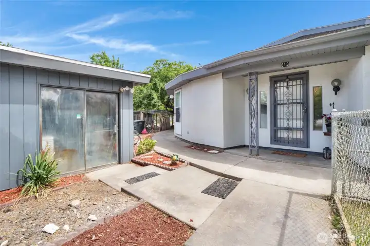 The detached garage on the left has room for four cars or two and a big truck! In between the house and garage you see a chicken coop, which can stay or go!