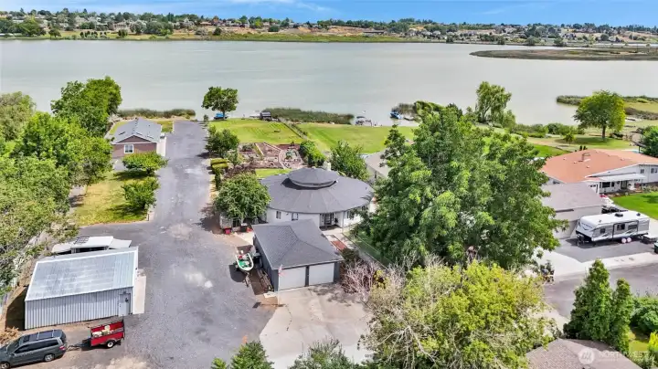 3,726 square feet await you in this four bedroom, two bath home with the living room in the center, including a landscaped garden area on your own waterfront lot.