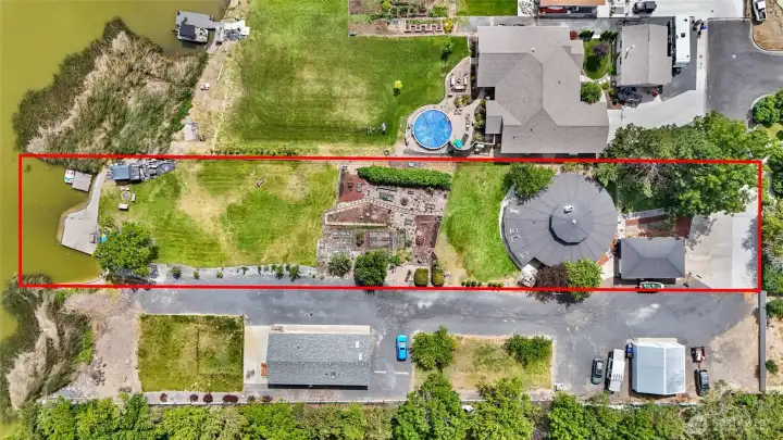 Isn't the garden space delightful? You also get a private boat launch, bulkhead, and your own waterfront dock!