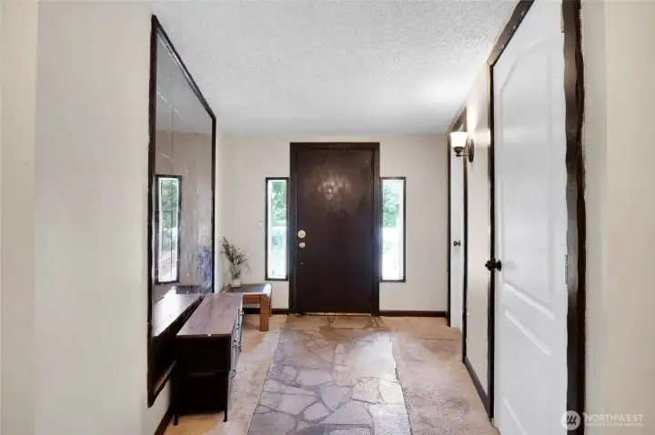 A view of the front door also gives you a view of the basement and utility room doorways.