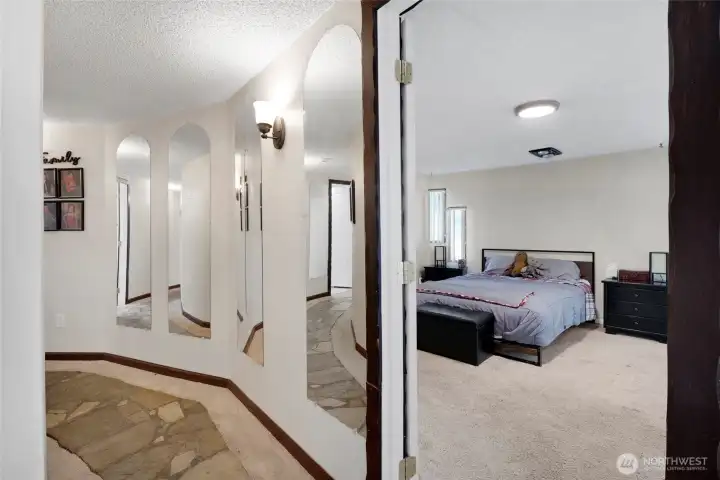 The primary bedroom has a couple of walk-in closets and large custom bathroom with a jetted tub and shower.