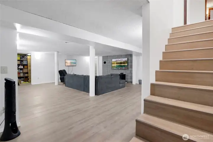 Welcome to the lower level! This is brand new flooring downstairs and on the steps. Just imagine what you could do with all of this space!