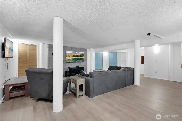 The lower level is a great area for recreation or just a movie night. Almost 3/4 of the lower level is surrounded by storage shelving and cupboards. The pressure tank for the well is in one of the closets.