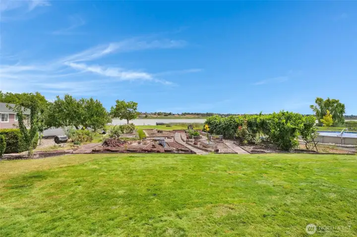 You'll want to spend plenty of time in the beautifully landscaped garden and arbor tunnel of grapes!  Go down the path to the lake and launch your boat in your private boat launch!