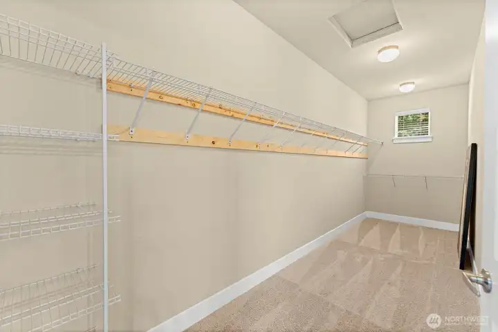 GIANT Primary walk-in closet GIANT Primary walk-in closet
