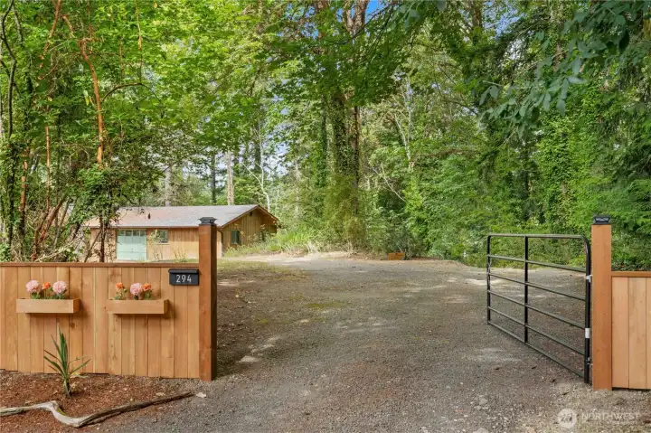 Private gated entrance welcomes you to this peaceful 4.61-acre waterfront retreat tucked among towering trees. Private gated entrance welcomes you to this peaceful 4.61-acre waterfront retreat tucked among towering trees.