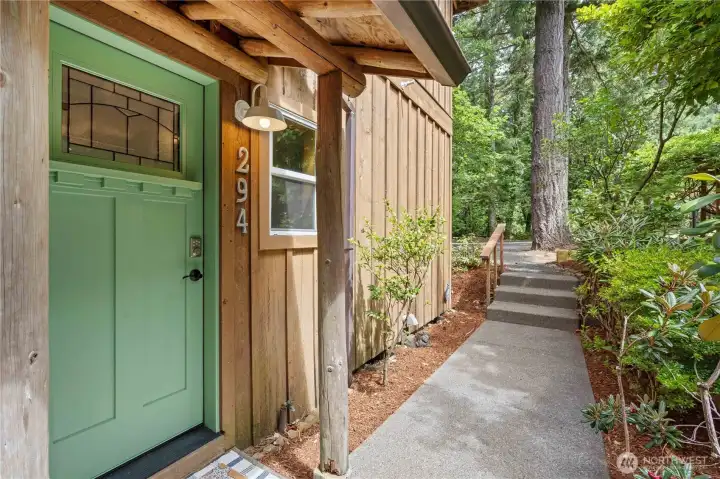 Covered entry welcomes guests into this move-in ready waterfront retreat. Covered entry welcomes guests into this move-in ready waterfront retreat.
