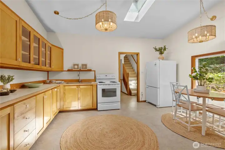 Bright kitchen with beautiful waterfront views, ample cabinetry, and an open layout perfect for entertaining. Bright kitchen with beautiful waterfront views, ample cabinetry, and an open layout perfect for entertaining.