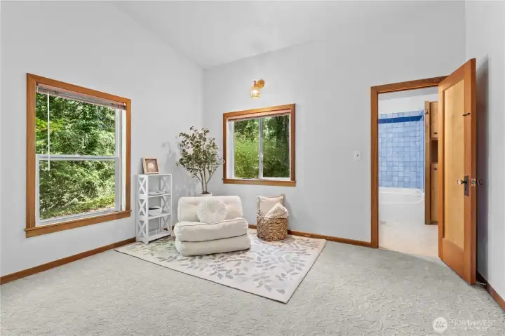 Flexible sitting area or guest space overlooking the surrounding forest and landscaped grounds. Flexible sitting area or guest space overlooking the surrounding forest and landscaped grounds.