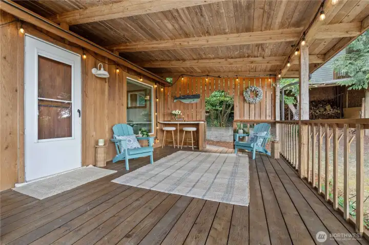 Covered waterfront porch creates the perfect outdoor living space for relaxing and entertaining year-round. Covered waterfront porch creates the perfect outdoor living space for relaxing and entertaining year-round.