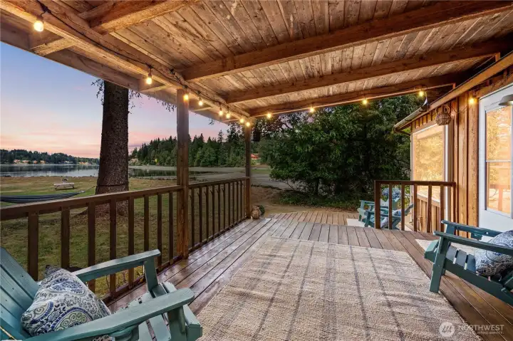 Expansive covered porch overlooking the private lawn and Hammersley Inlet. Expansive covered porch overlooking the private lawn and Hammersley Inlet.