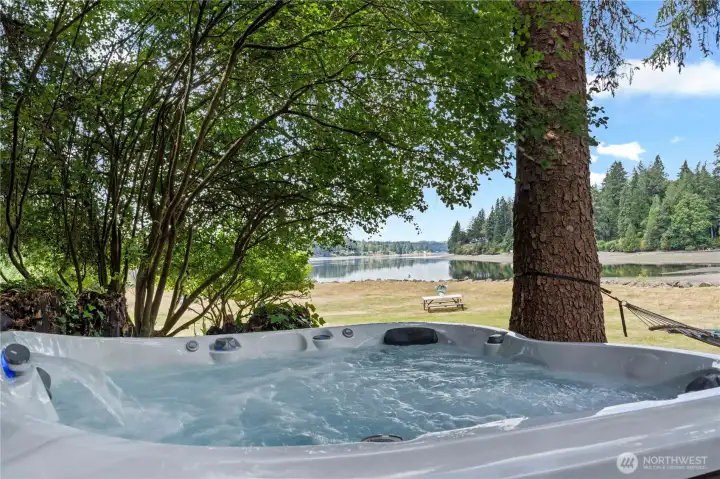 Relax in the private hot tub while taking in peaceful Hammersley Inlet views, towering evergreens, and the tranquil waterfront setting. Relax in the private hot tub while taking in peaceful Hammersley Inlet views, towering evergreens, and the tranquil waterfront setting.