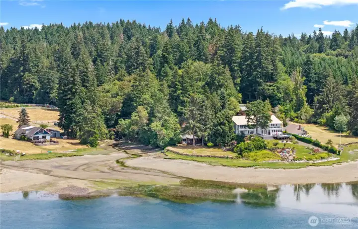 Aerial perspective highlighting the home's private waterfront location, surrounding forest, and protected shoreline along Hammersley Inlet. Aerial perspective highlighting the home's private waterfront location, surrounding forest, and protected shoreline along Hammersley Inlet.