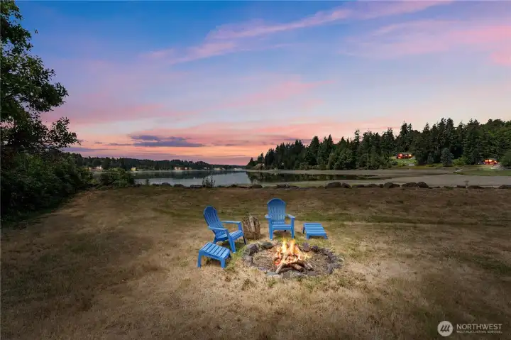Gather around the waterfront fire pit beneath colorful Pacific Northwest sunsets while enjoying panoramic inlet views and unforgettable evenings. Gather around the waterfront fire pit beneath colorful Pacific Northwest sunsets while enjoying panoramic inlet views and unforgettable evenings.