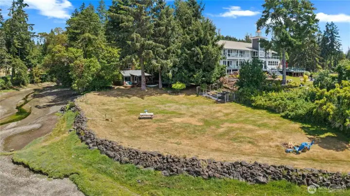 Private waterfront retreat featuring approximately 250± feet of shoreline, expansive level lawn, mature trees, and breathtaking Puget Sound waterfront living. Private waterfront retreat featuring approximately 250± feet of shoreline, expansive level lawn, mature trees, and breathtaking Puget Sound waterfront living.