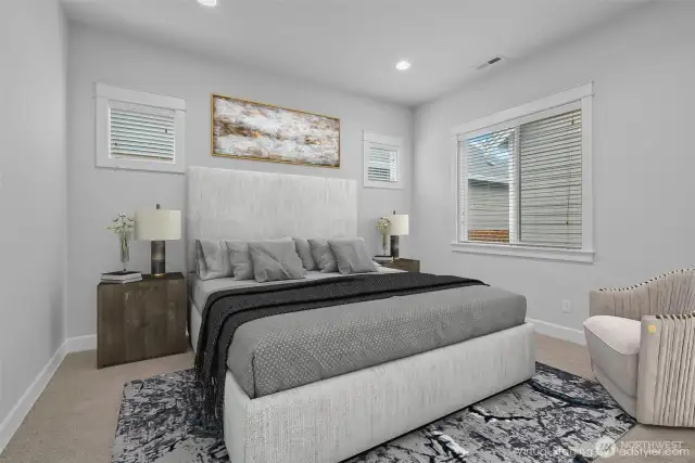Spacious primary en-suite featuring a walk-in closet, a luxurious bathroom, a wood-wrapped window, and transom windows that bathe the room in natural light while preserving privacy and adding architectural elegance.