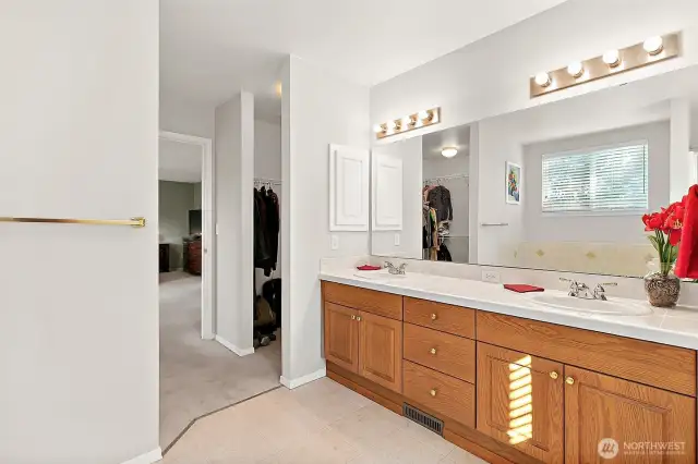Primary Bathroom with walkthrough closets to Primary Bedroom