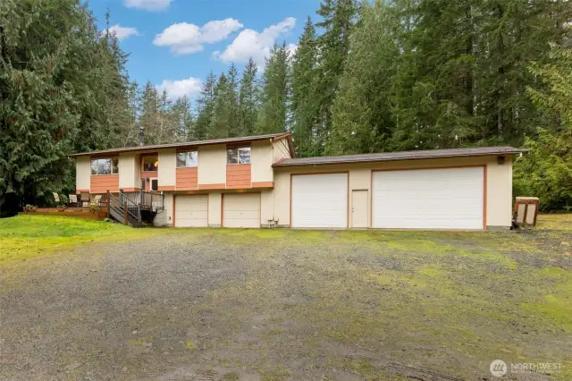 Notice the 2 car garage AND the 3 car shop with 10ft doors!