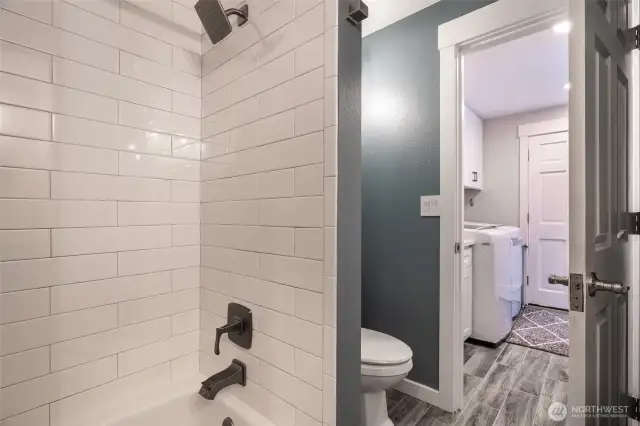 Custom tiling in bath/shower - connected to Laundry room