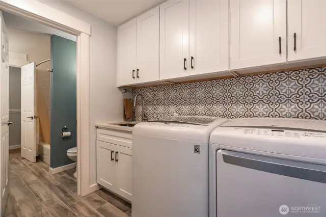 Updated laundry room with utility sink - access to back yard