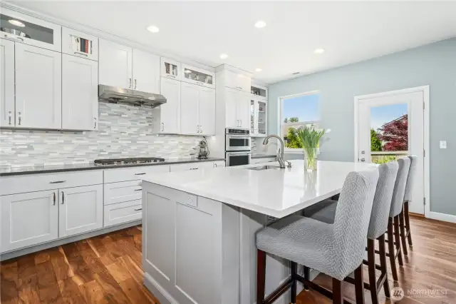 Fully remodeled in 2019! White cabinets, white Quartz counters, tile backsplash, gas cooking and stainless steel appliances.
