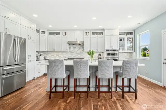 Fully remodeled in 2019! White cabinets, white Quartz counters, tile backsplash, gas cooking and stainless steel appliances.
