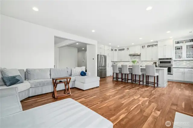 Open concept family room and kitchen with bar seating.