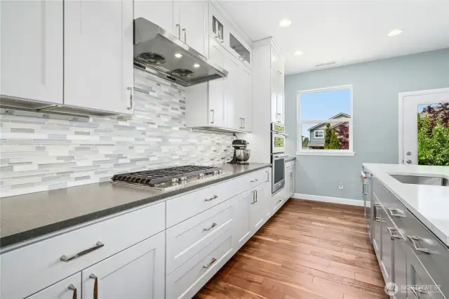 Fully remodeled in 2019! White cabinets, white Quartz counters, tile backsplash, gas cooking and stainless steel appliances.