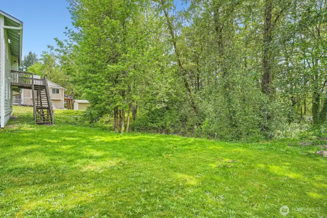 This lot is huge! The wooded area is wetlands, so no worries about new neighbors behind you.