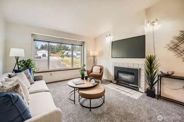 Cozy living room for gathering or relaxing. The carpeting is new throughout the house.