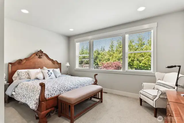Primary bedroom with lots of natural light.